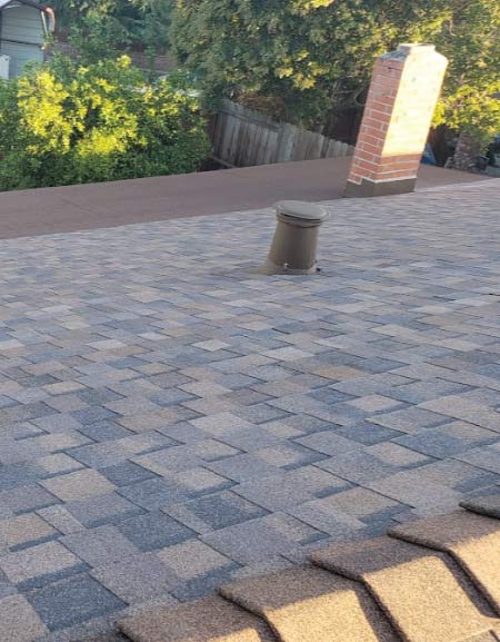 metal-roof detail view of an asphalt shingle roofing