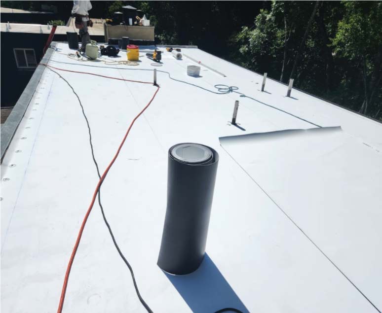 cool flat roof beign fixed by the best roofing contractors in antioch, ca