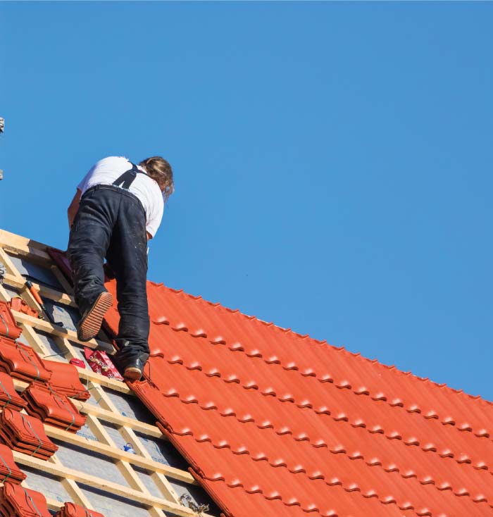 tile roofer building a tile roof